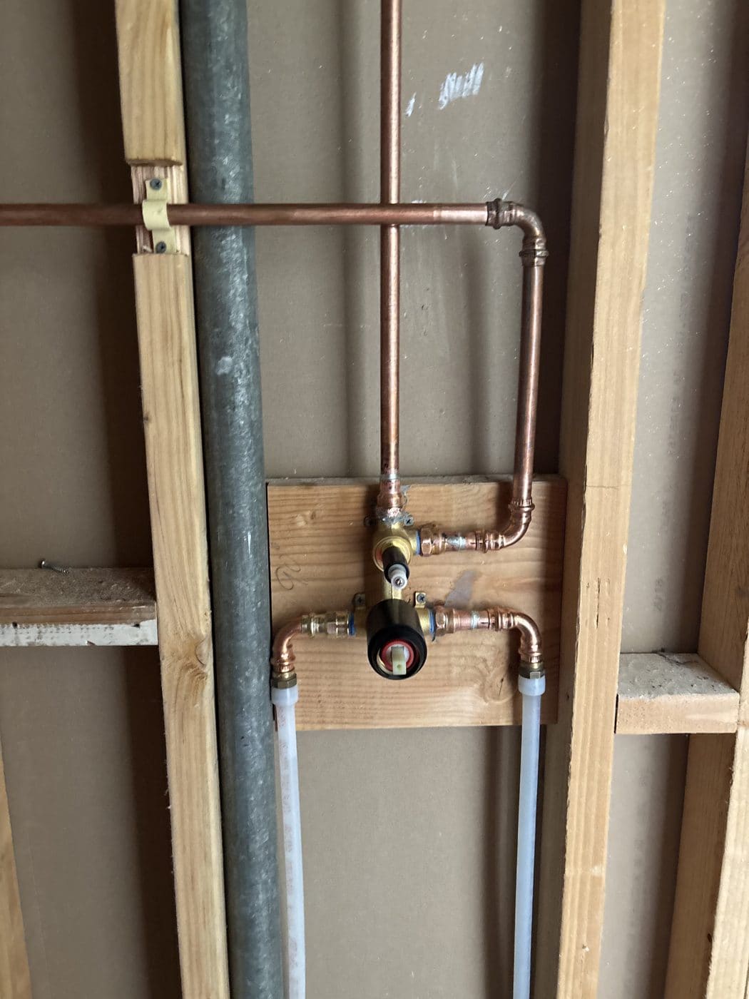 New copper plumbing connections inside an open wall
