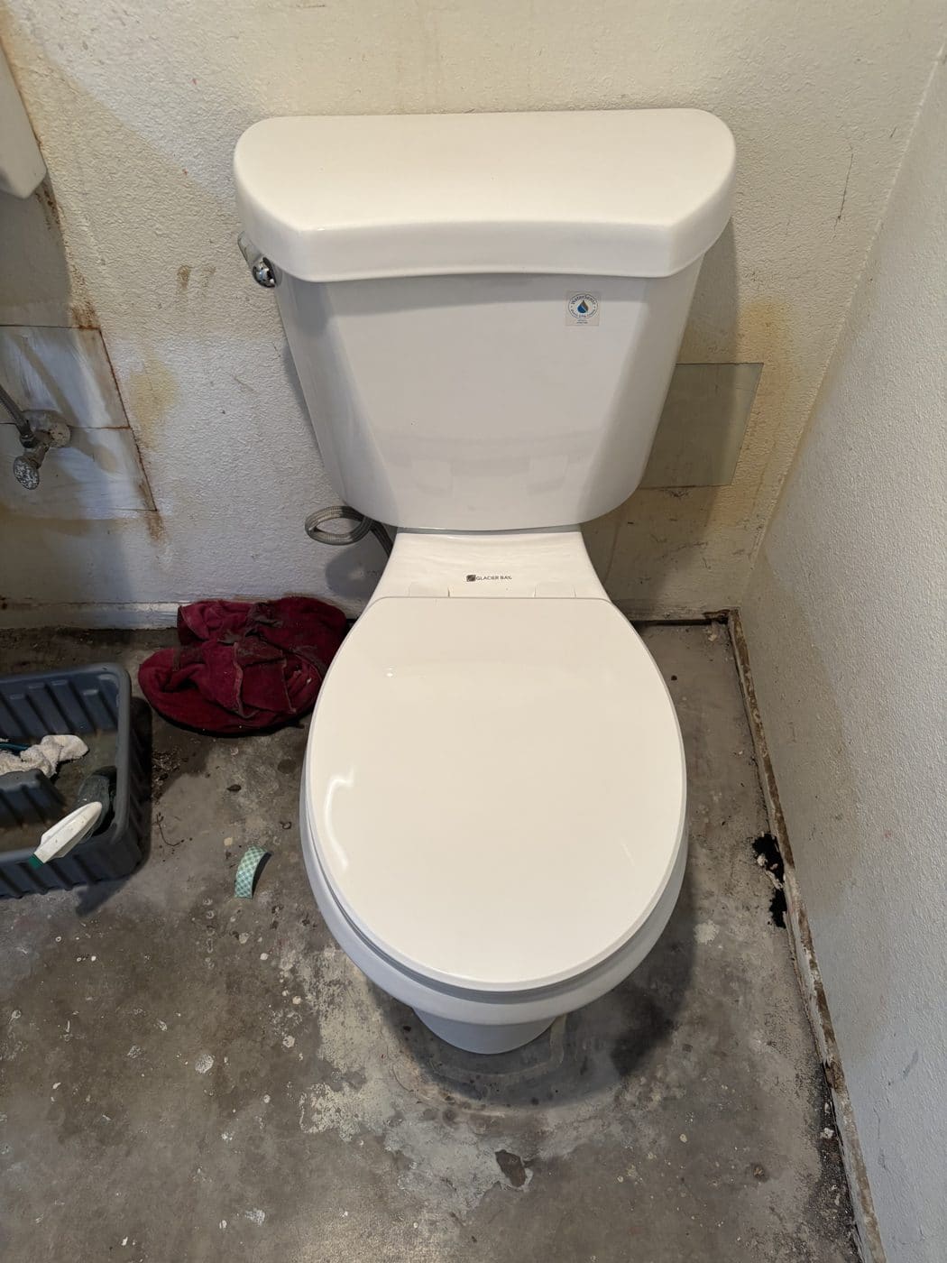 Toilet and supply connection during a bathroom plumbing project